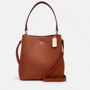 Coach bucket crossbody 👜
Color redwood/gold hardware
New with tags